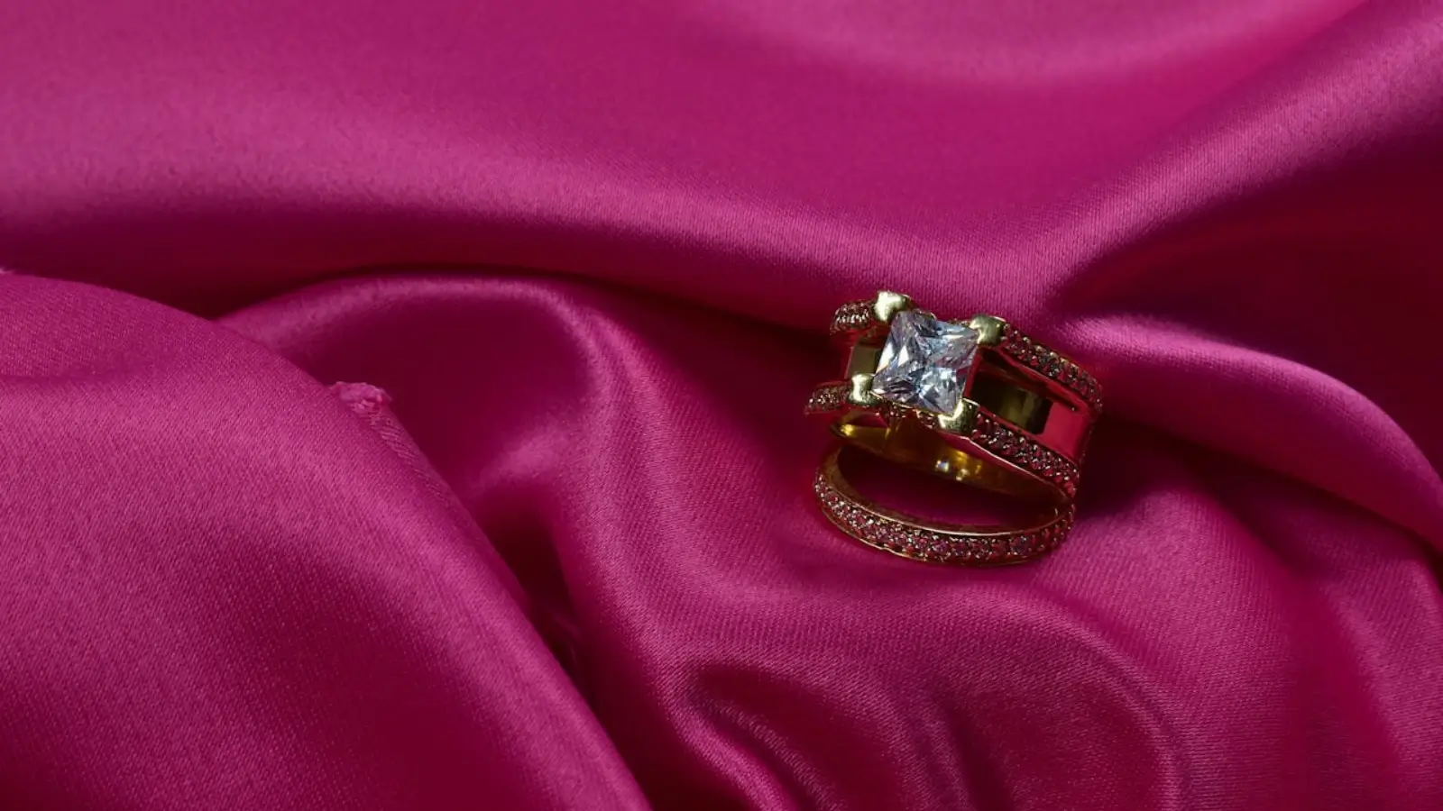 Modern engagement and wedding ring stack with mixed metals and gemstones