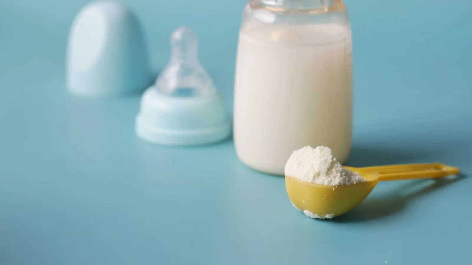 Organic maltodextrin powder beside baby food ingredients and formula packaging
