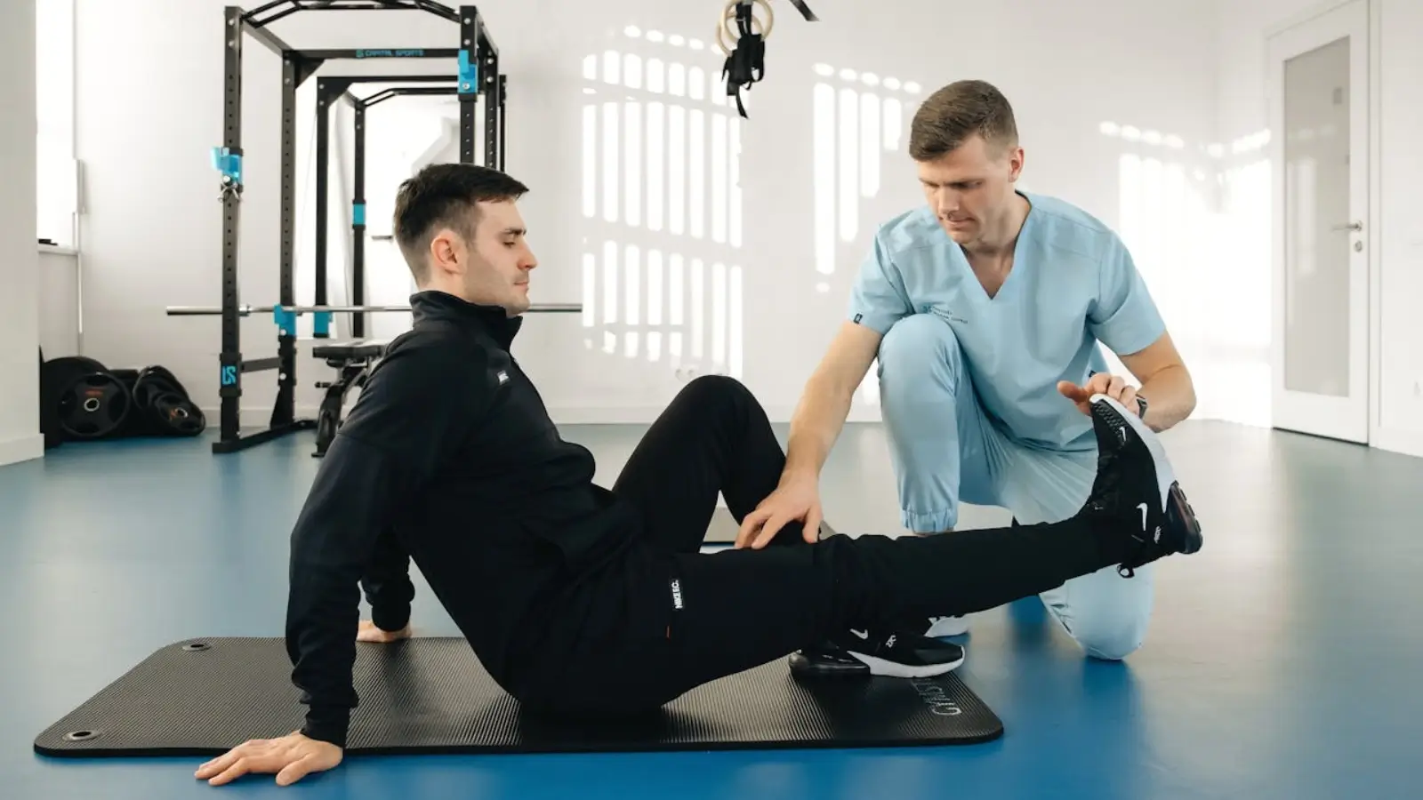 Physiotherapist guiding a patient through recovery exercises in a calming, supportive environment