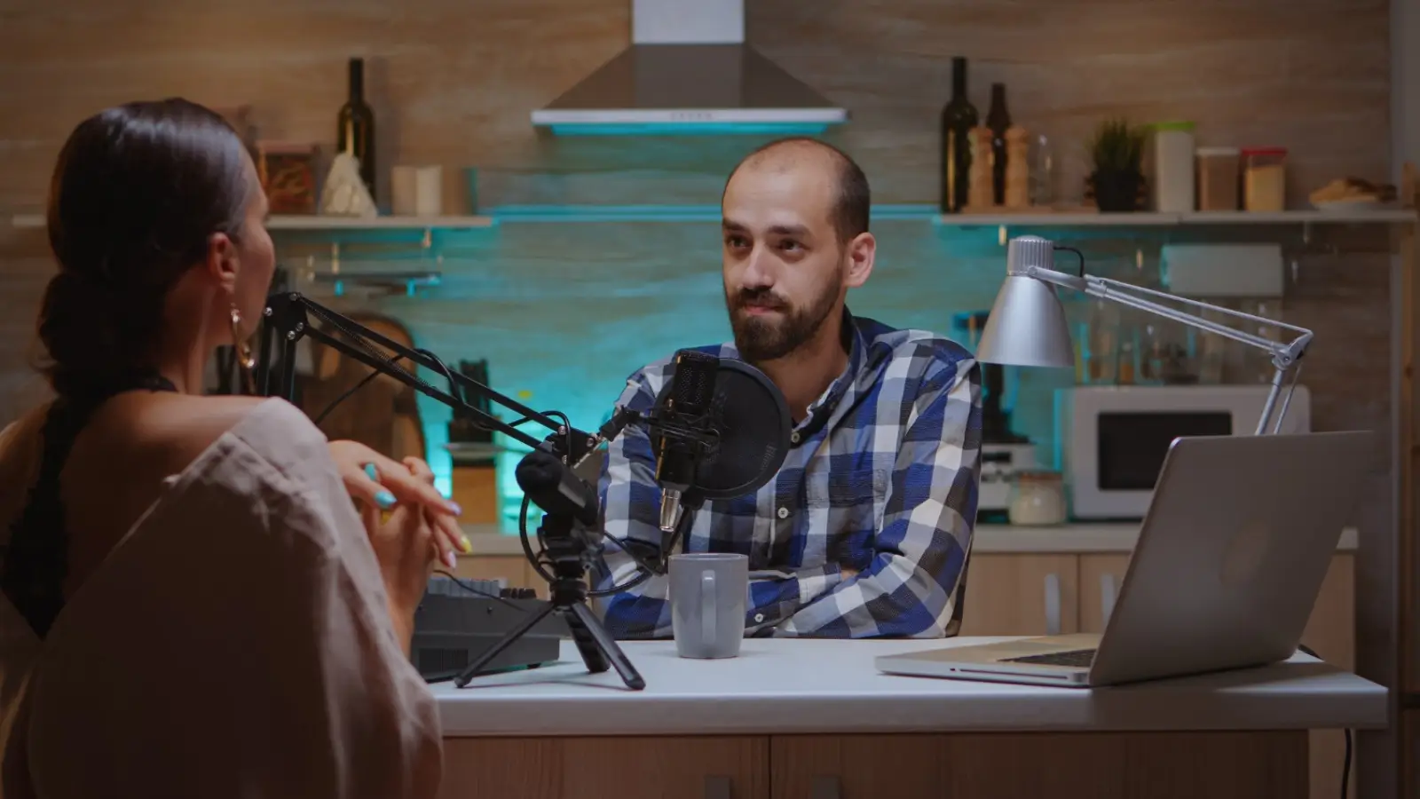 Podcast host recording in a studio, symbolizing the rise of streaming voices in digital media