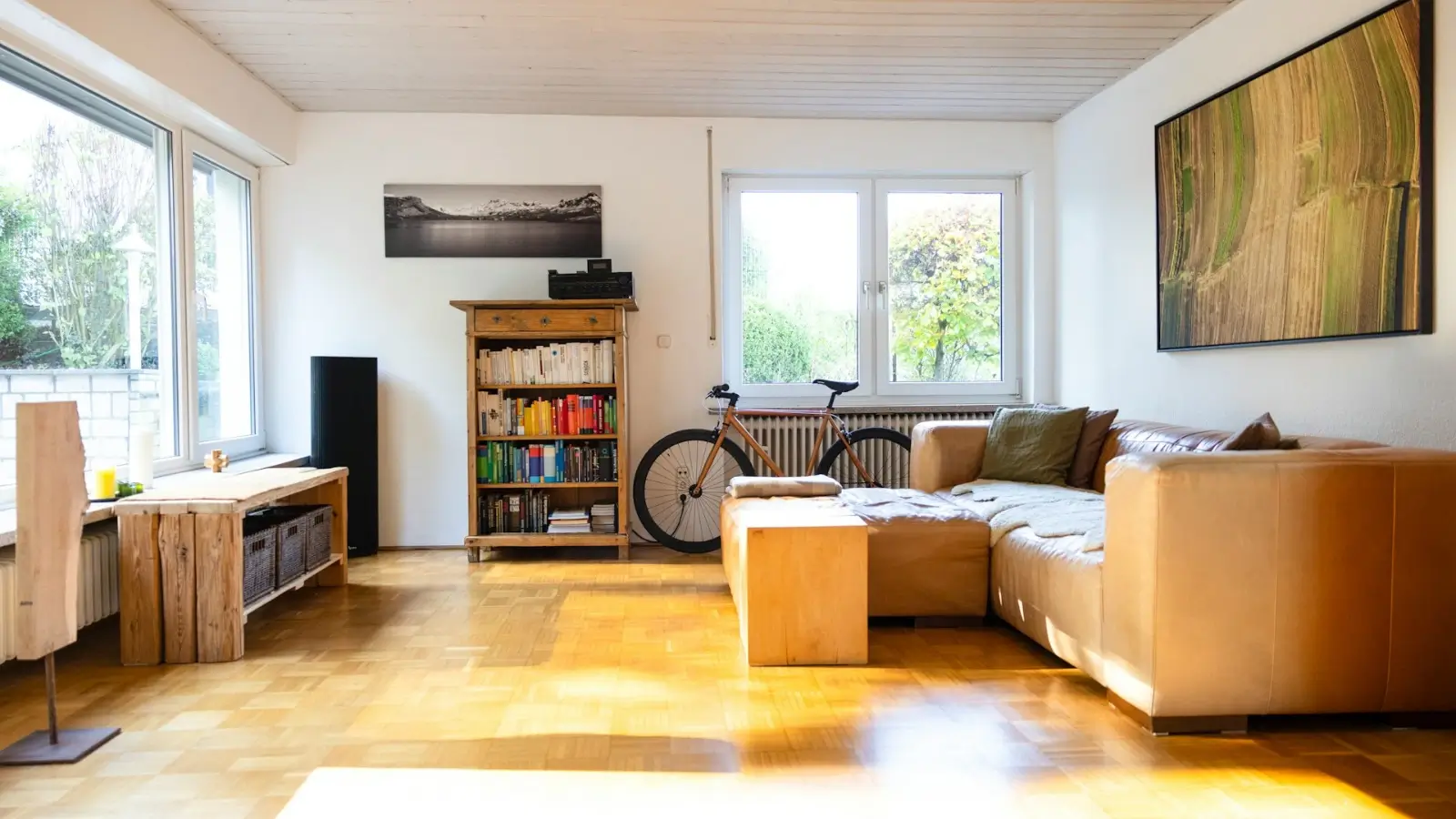 Professional home cleaner tidying a modern living room with eco-friendly products