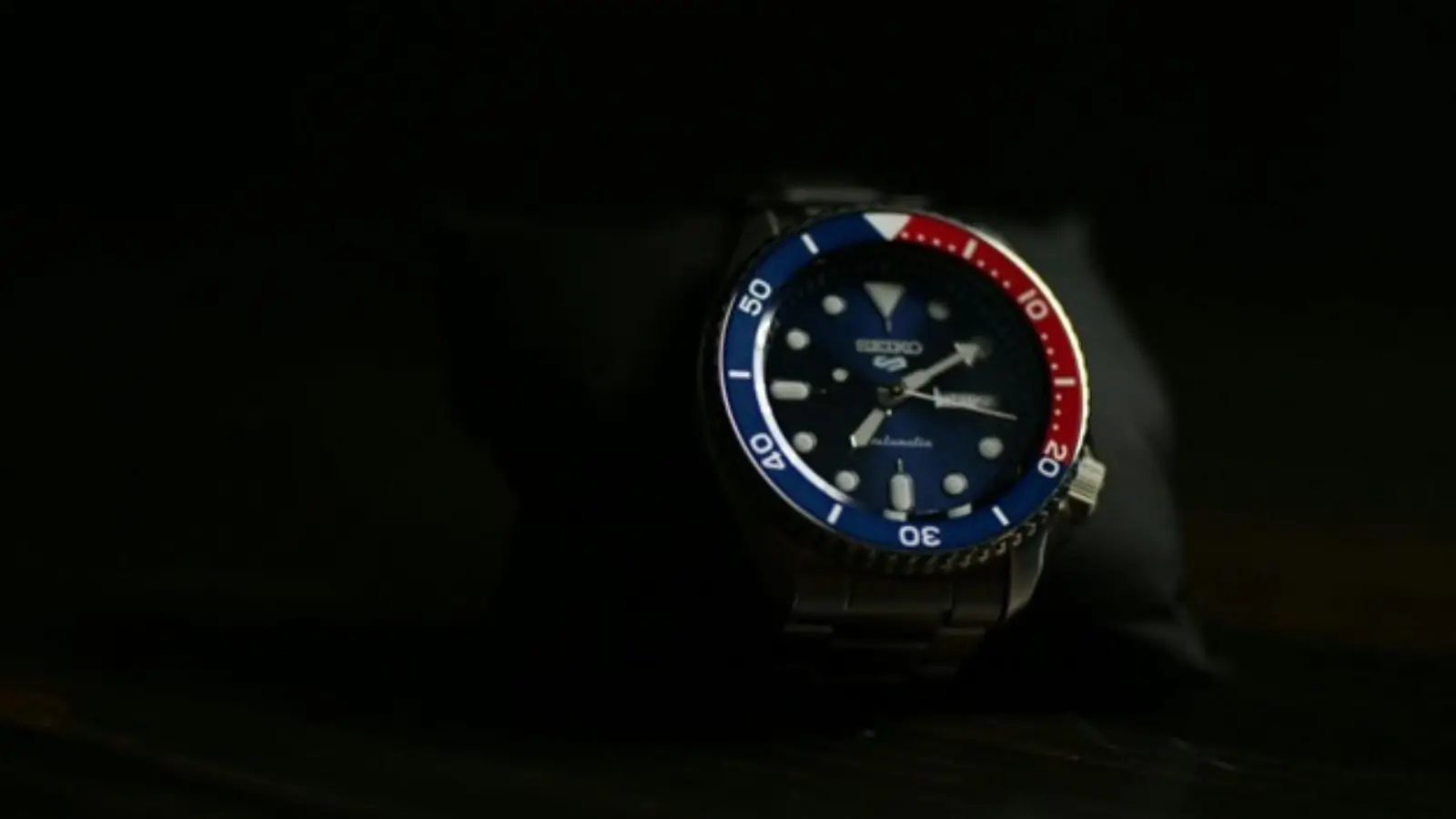 Professional watch buyer evaluating a luxury watch for authenticity and value