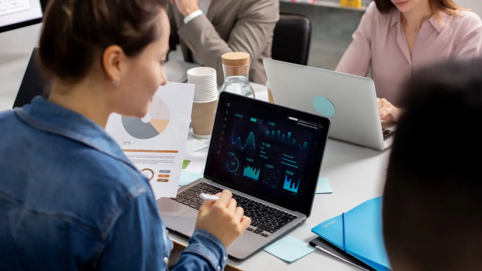 Researcher using AI-powered data analysis tools on a digital dashboard