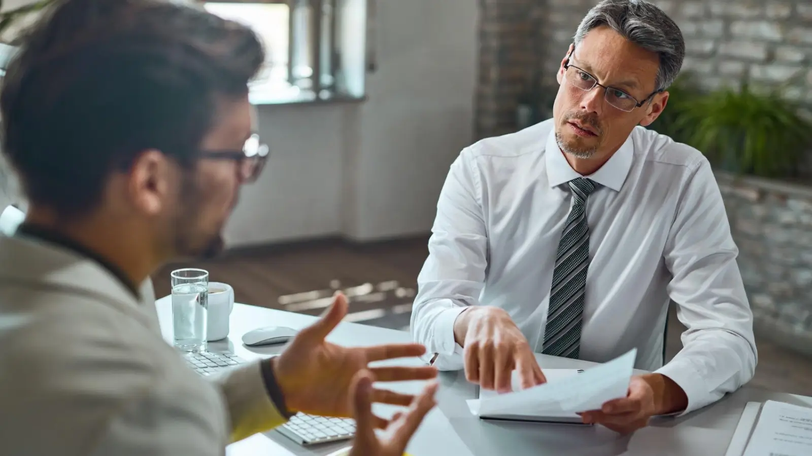 Self-employed professional consulting with a car accident lawyer about lost income compensation