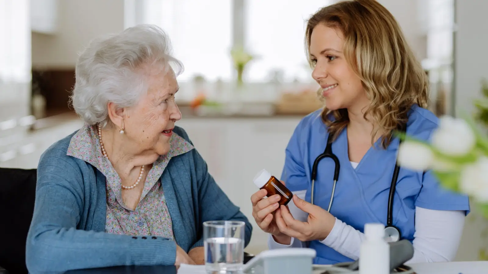Senior woman using Medicare Flex Card at grocery store checkout
