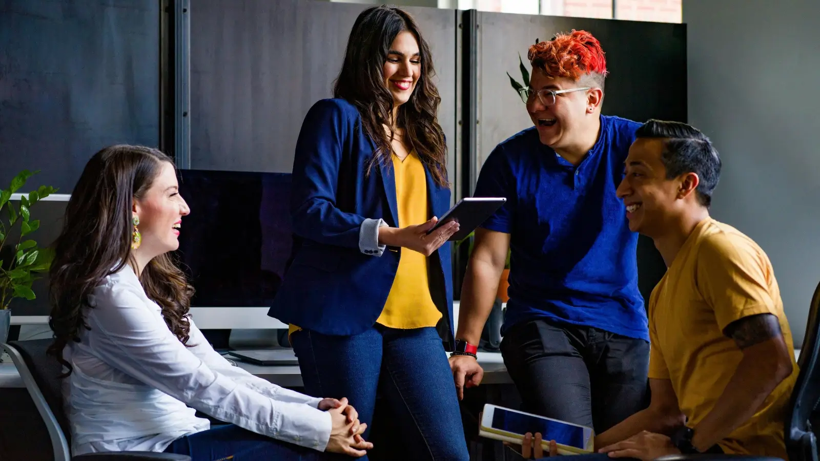 Small business team celebrating success with strong leadership and employee engagement