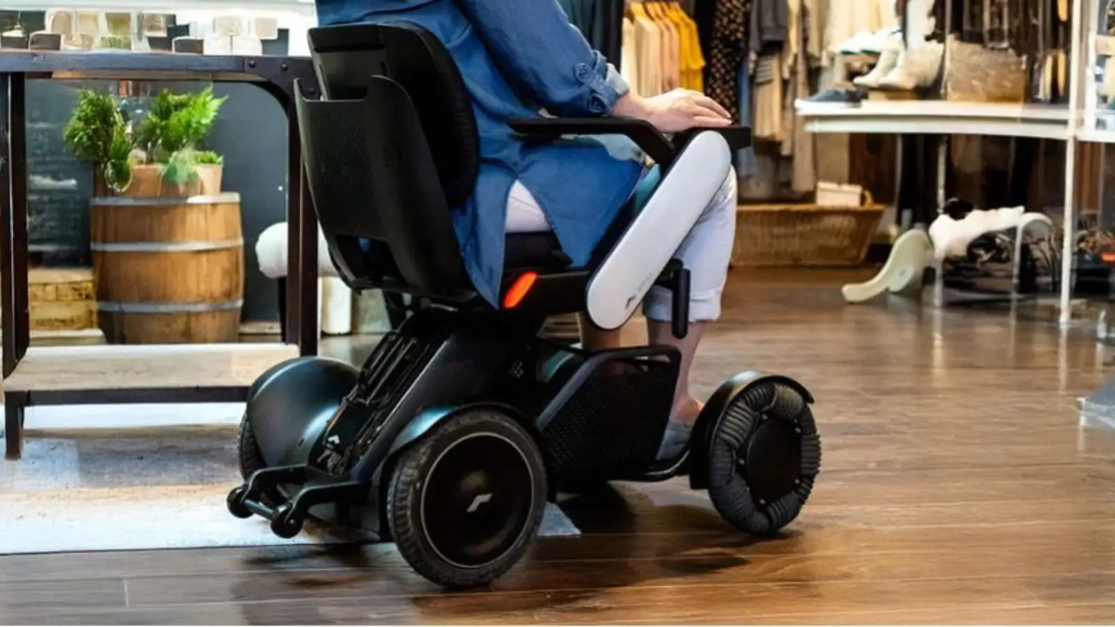 Smart electric wheelchair in modern home setting with user navigating comfortably