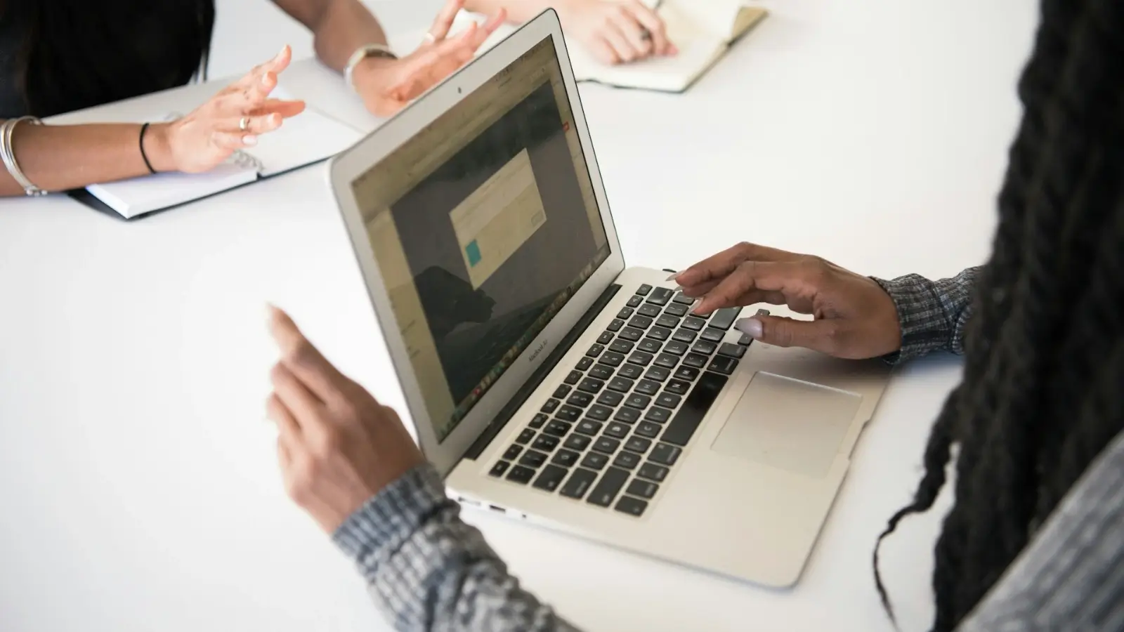 Team using business software tools to collaborate on digital dashboard