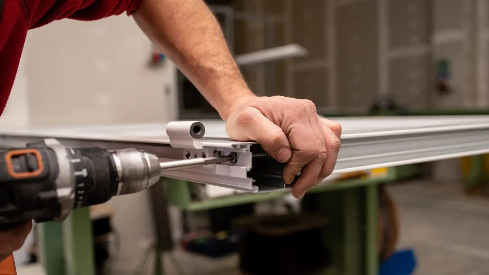 Technician installing a modern garage door with professional tools