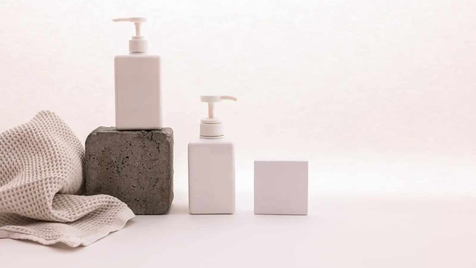 The Skin Company skincare products arranged with minimalist packaging on a clean surface