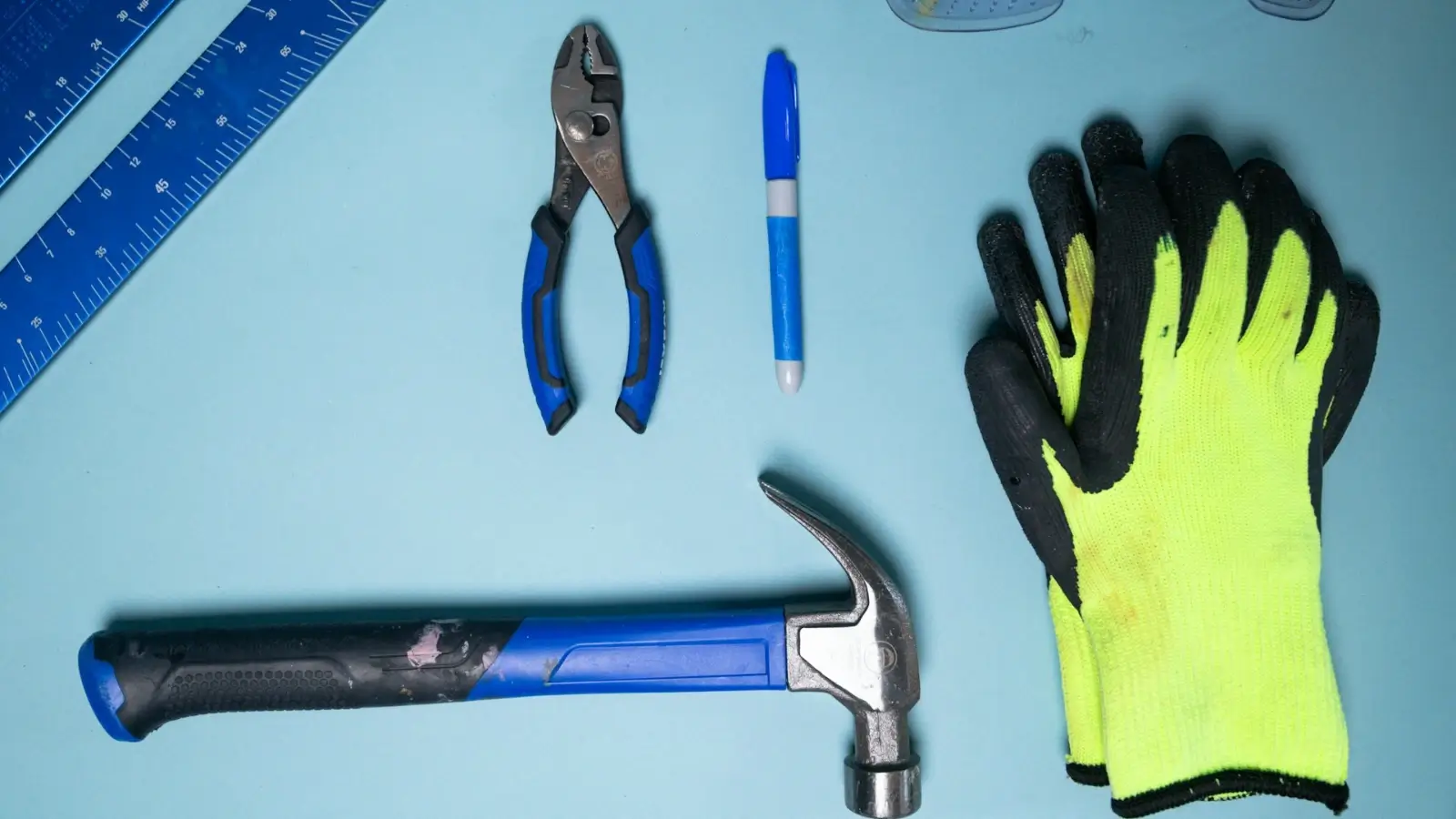 Tradie securing tools in a lockable ute canopy under bright daylight