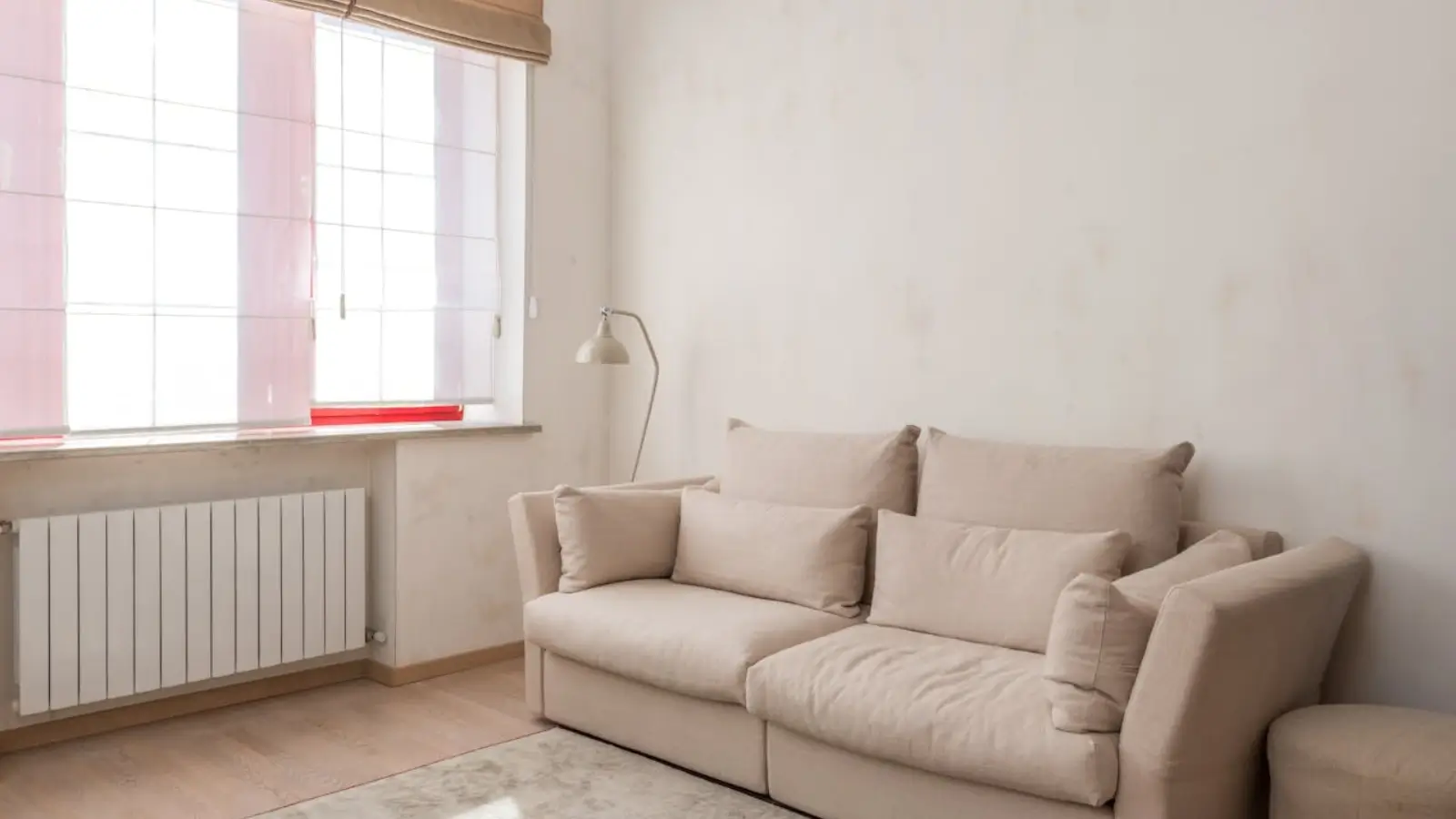 Traditional cast iron radiator in a modern living room setting