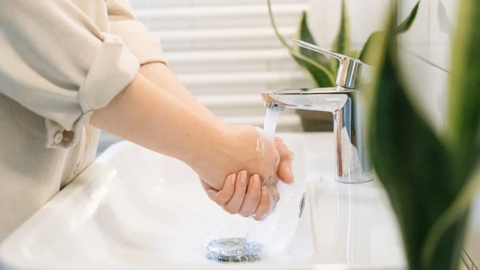 Traveler washing hands to prevent infectious diarrhea