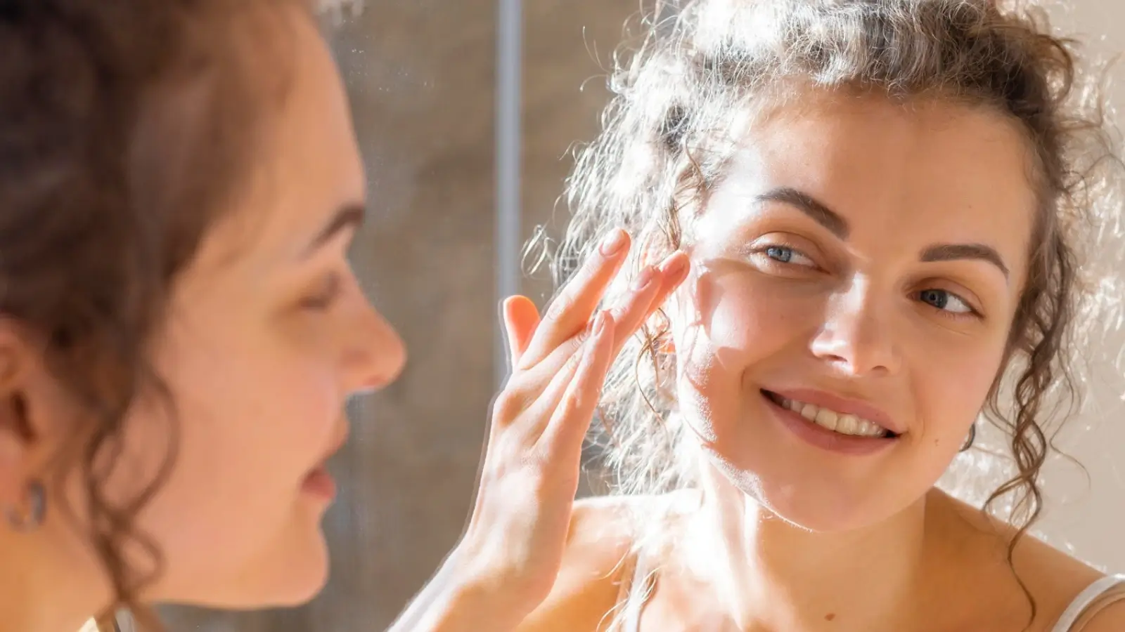 Woman enjoying a relaxing shower with a water-purifying shower filter