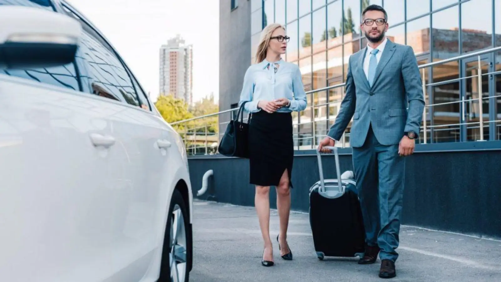 Business traveler reviewing rental car excess insurance policy at the airport.