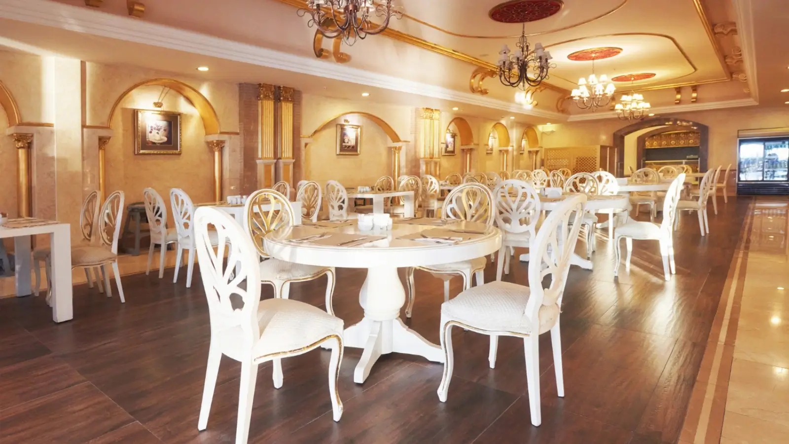 Elegant restaurant interior with wooden tables and upholstered chairs set for dining