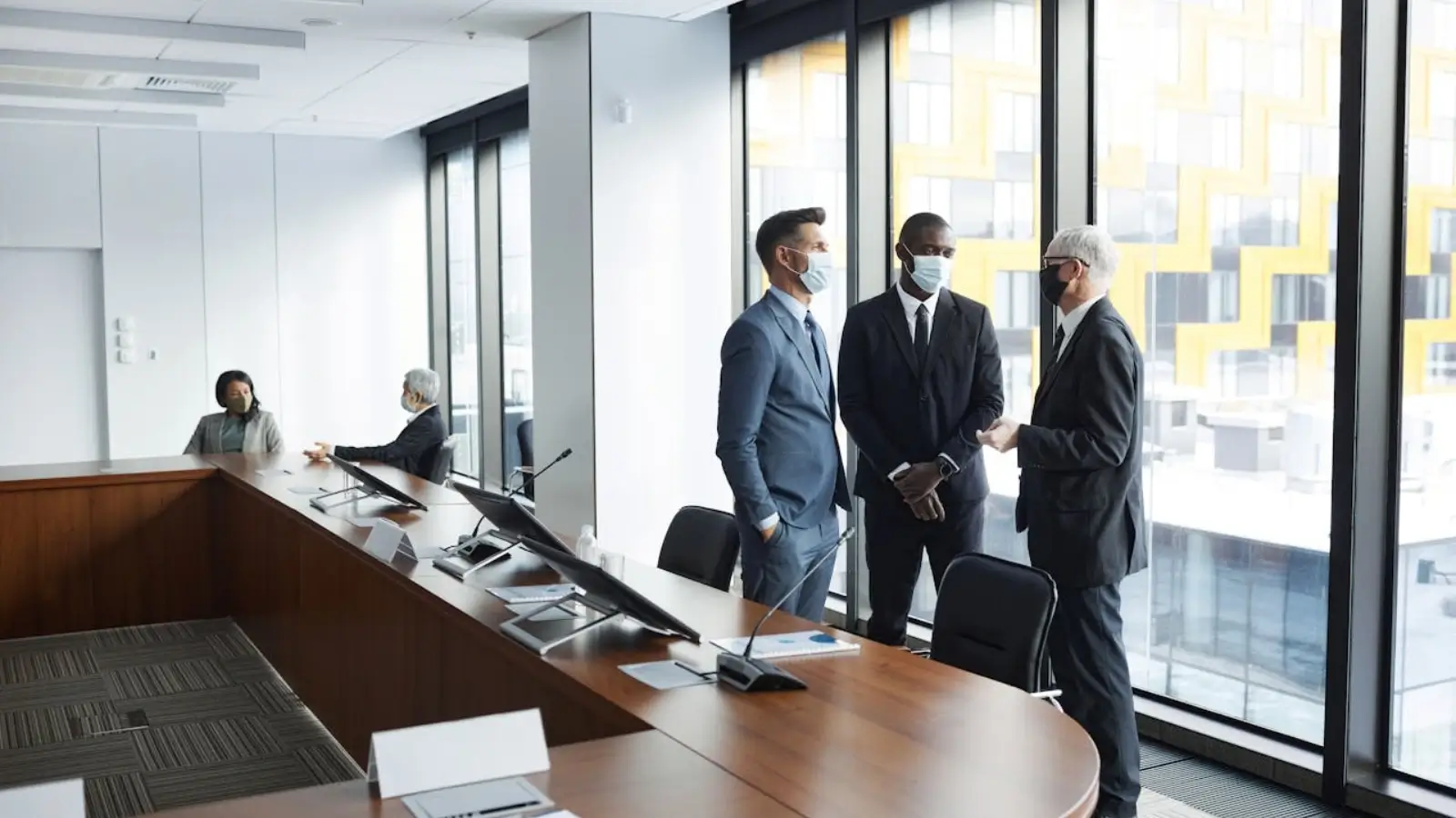 Entrepreneurs networking at a high-end business event in Dubai with skyline views