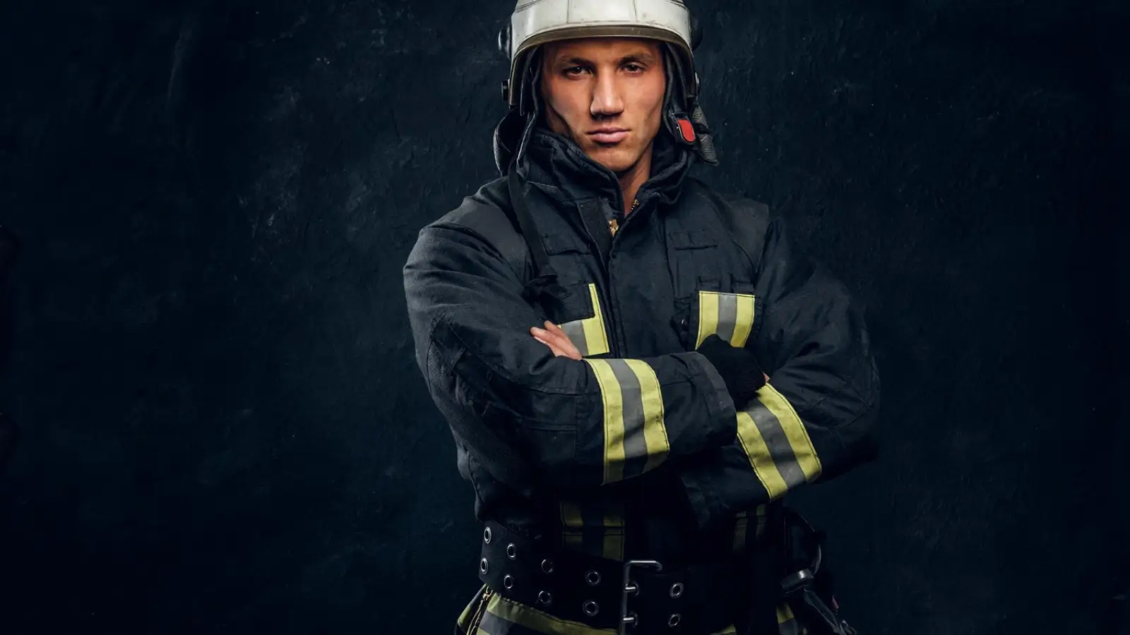 First responder tactical gear including boots, gloves, flashlight, and medical kit