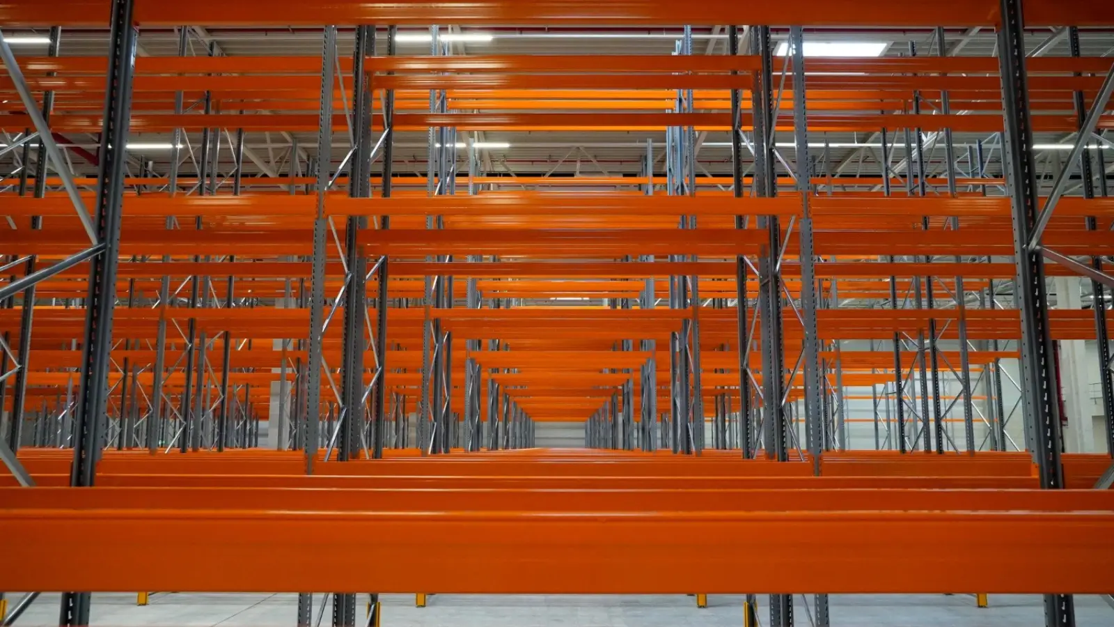 Heavy-duty cantilever racking system installed in a warehouse storing steel beams