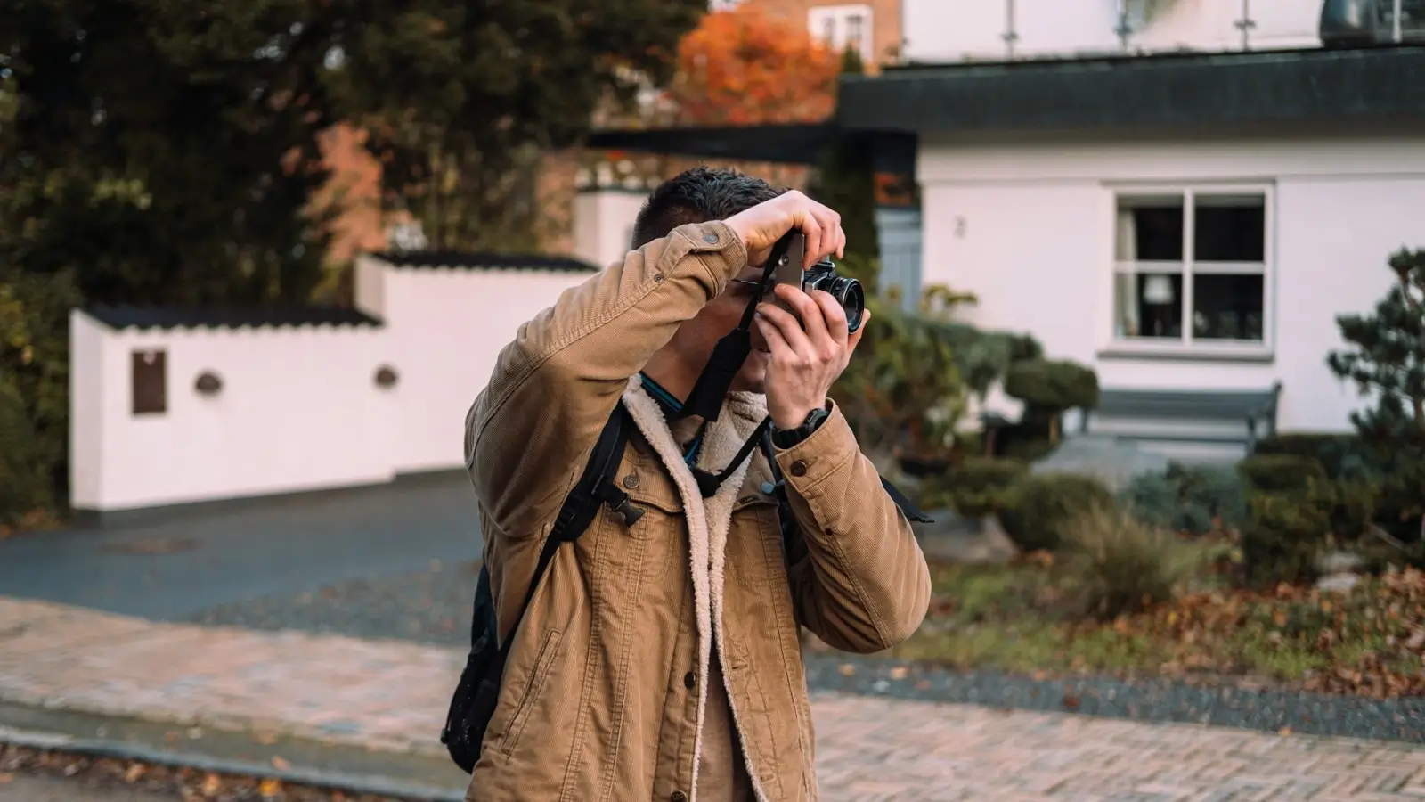 Man wearing layered outerwear for cold and rainy weather outdoors