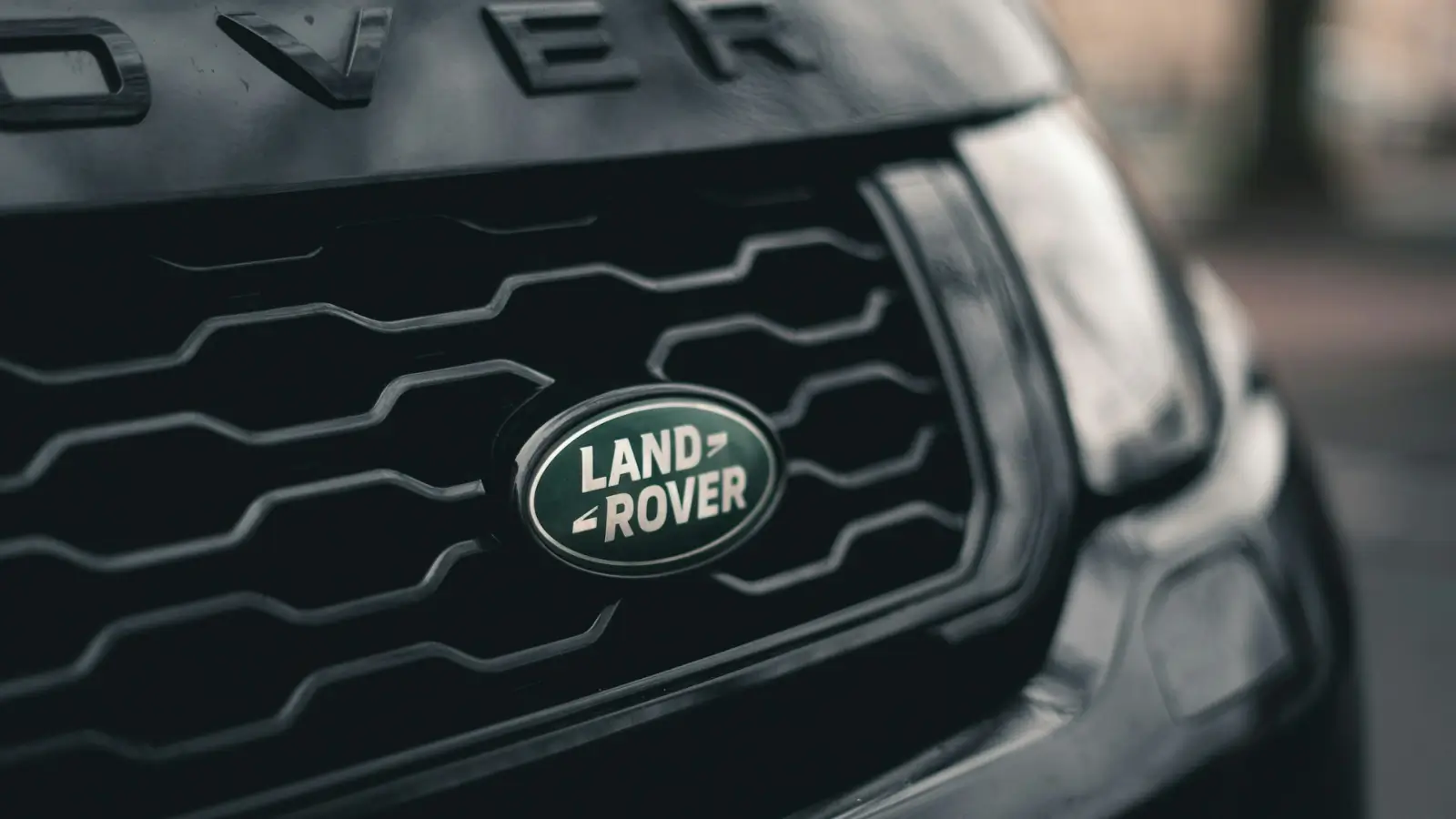 Mechanic handling Land Rover spare parts in a Sydney auto workshop