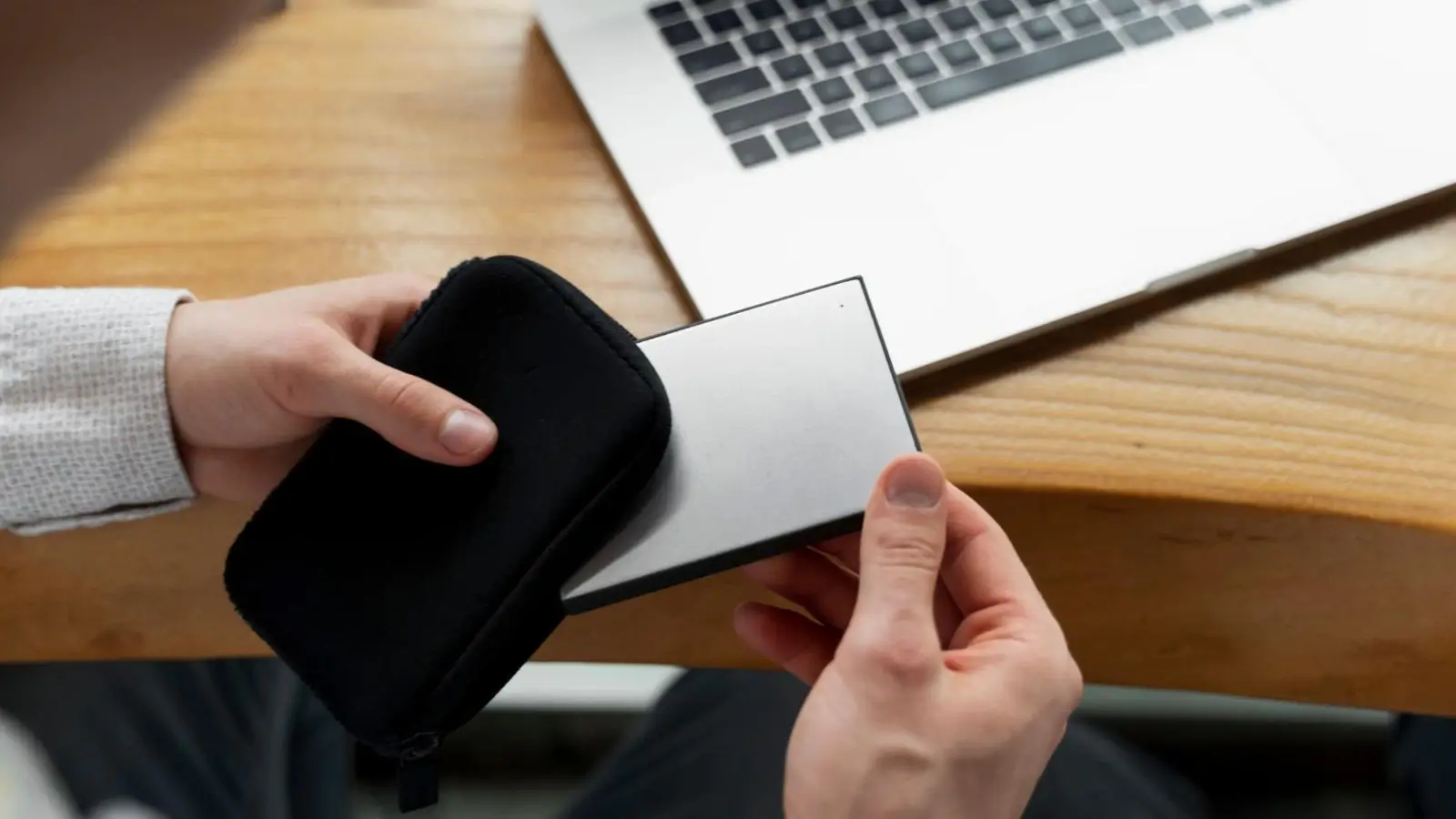 NFC metal business card being tapped on a smartphone for digital contact sharing