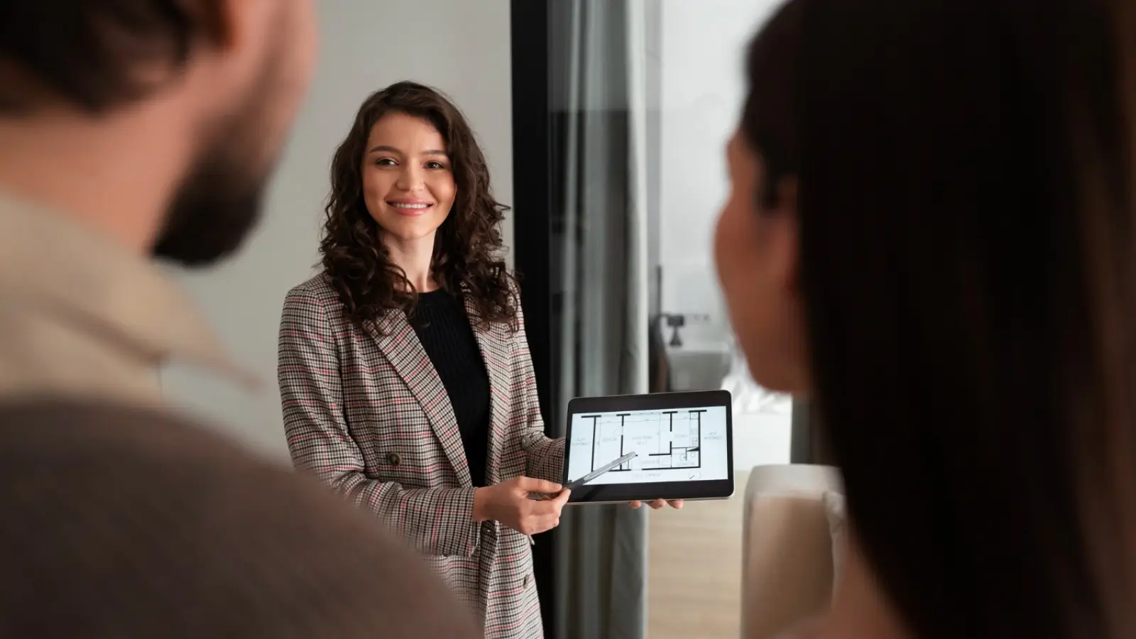 Real estate agent reviewing property leads with help from an AI voice assistant platform.