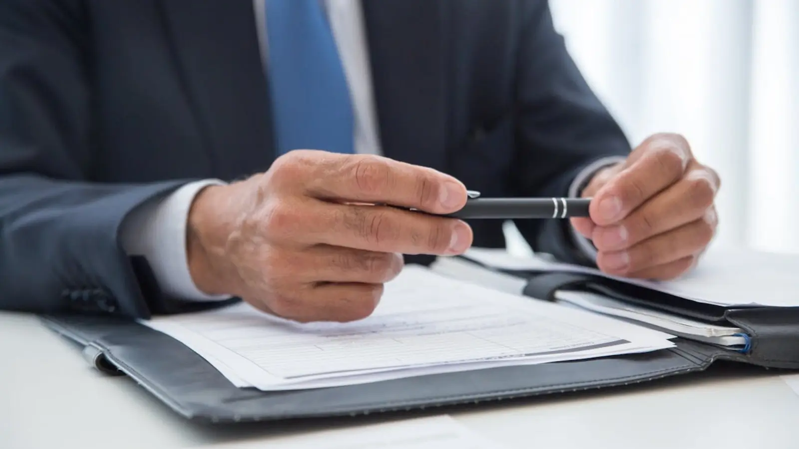 Texas TABC liquor license application form with legal documents and business registration papers