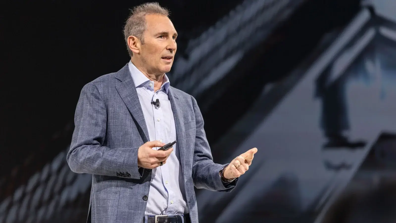 Andy Jassy Net Worth 2025: From AWS Pioneer to Amazon Billionaire Amazon CEO Andy Jassy speaking at a corporate event in front of AWS logo