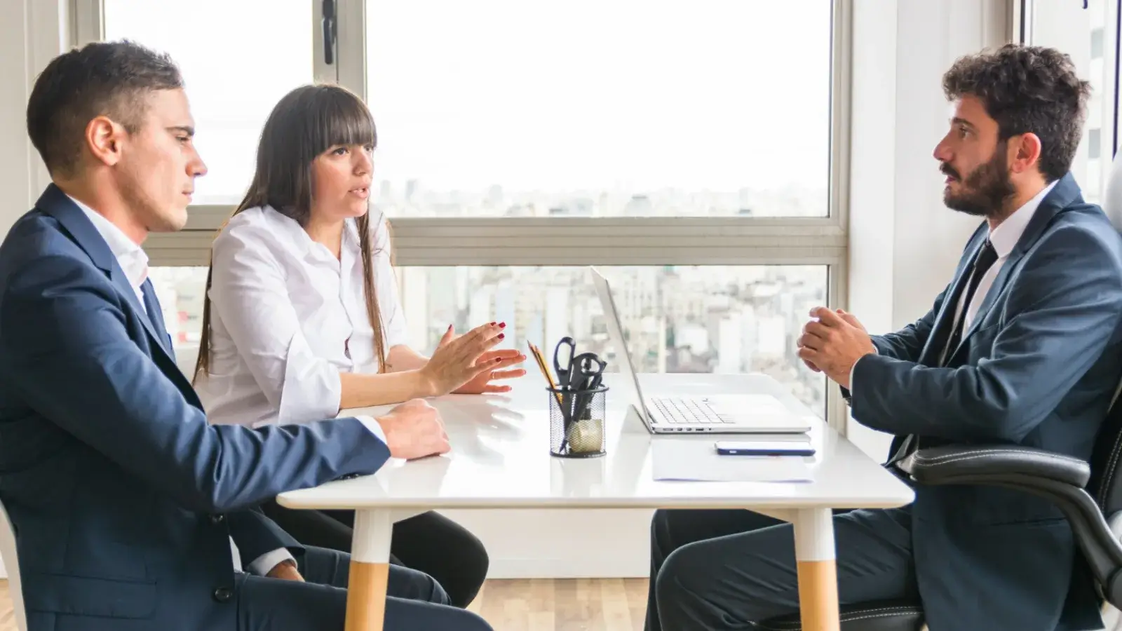Bridging the Gap: How Mediation & Conciliation Services Resolve Conflicts Peacefully Two people reaching agreement with mediator during conflict resolution session