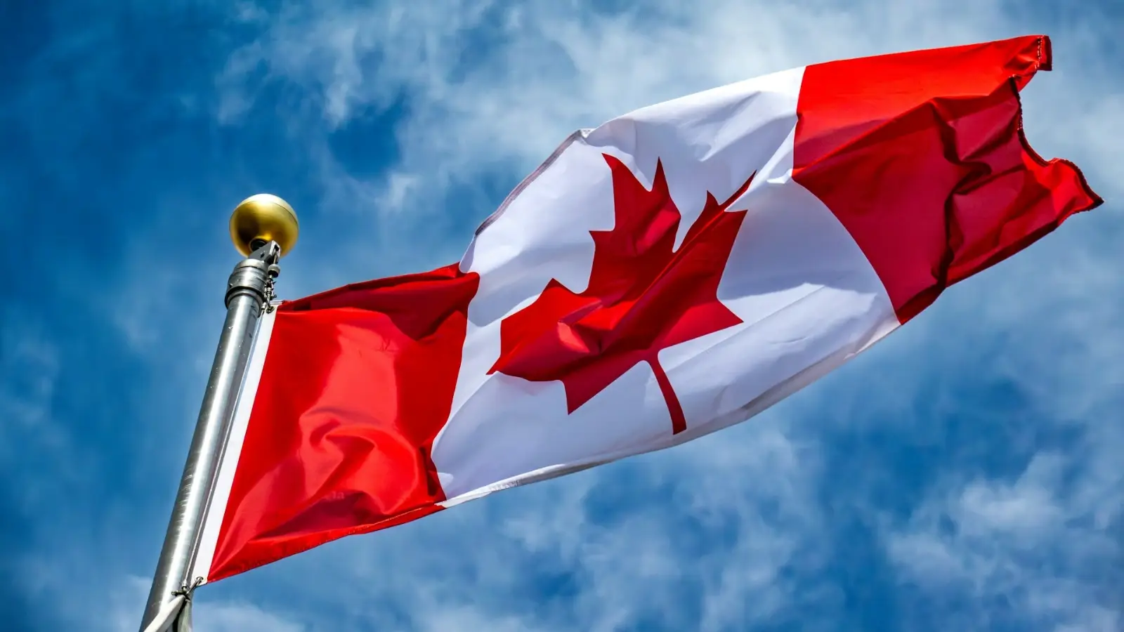 Beyond the Big Cities: Exploring Canada's Rural and Regional Immigration Pathways in 2025 Newcomer family exploring a small Canadian town with a "Welcome to Canada" sign