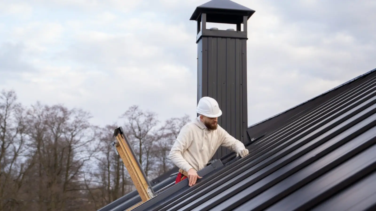 Under the Surface: How Minor Roof Issues Become Major Problems Over Time Roofer inspecting minor damage on a residential roof under clear sky