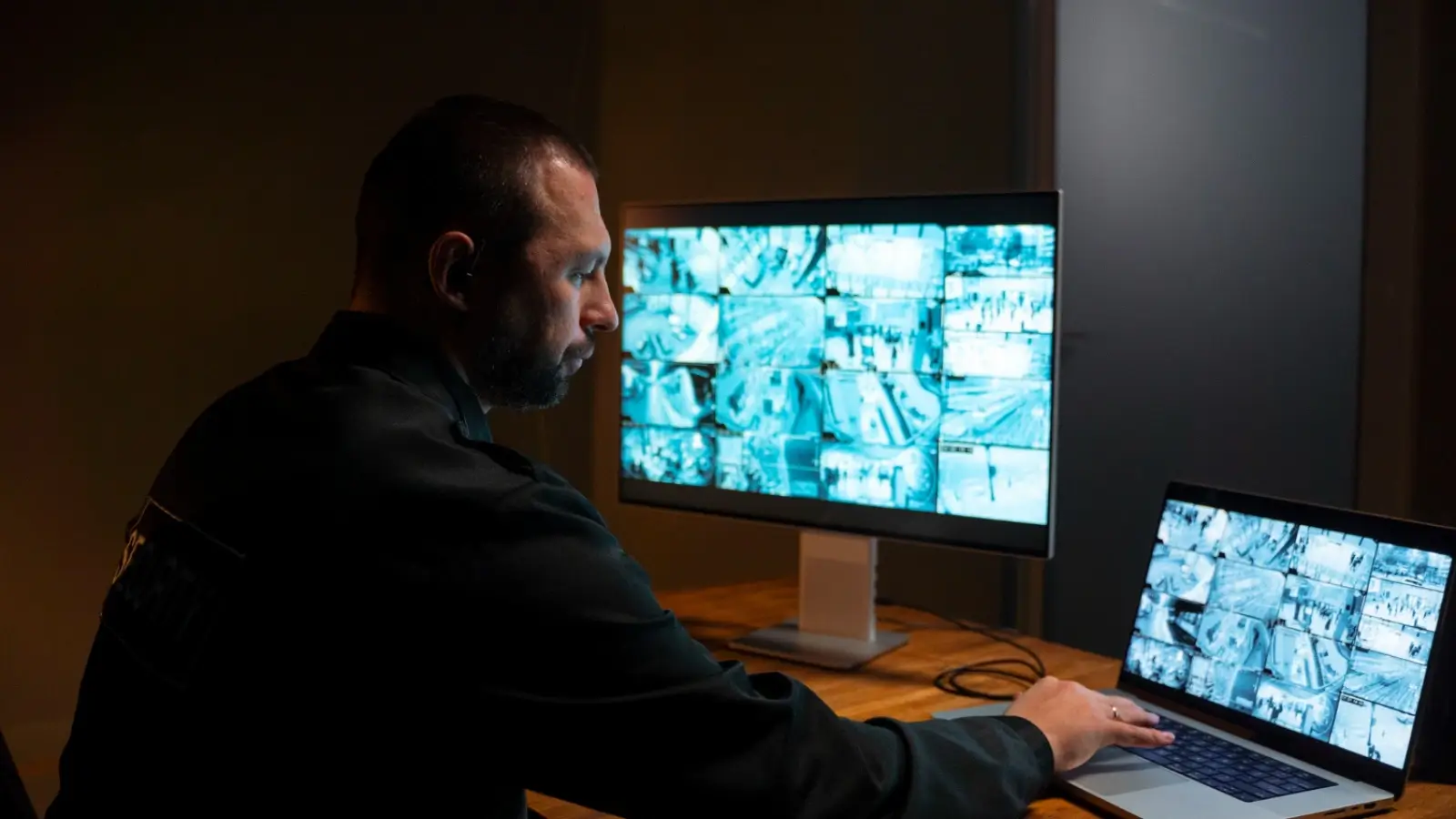 Security guard using technology and monitoring surroundings