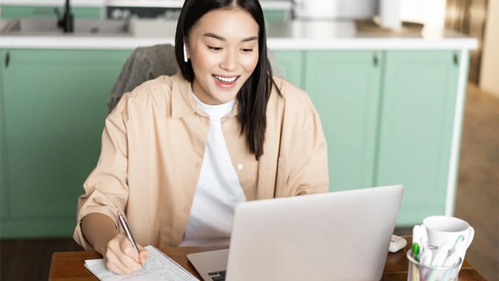 Virtual assistant working remotely on laptop with support dashboard