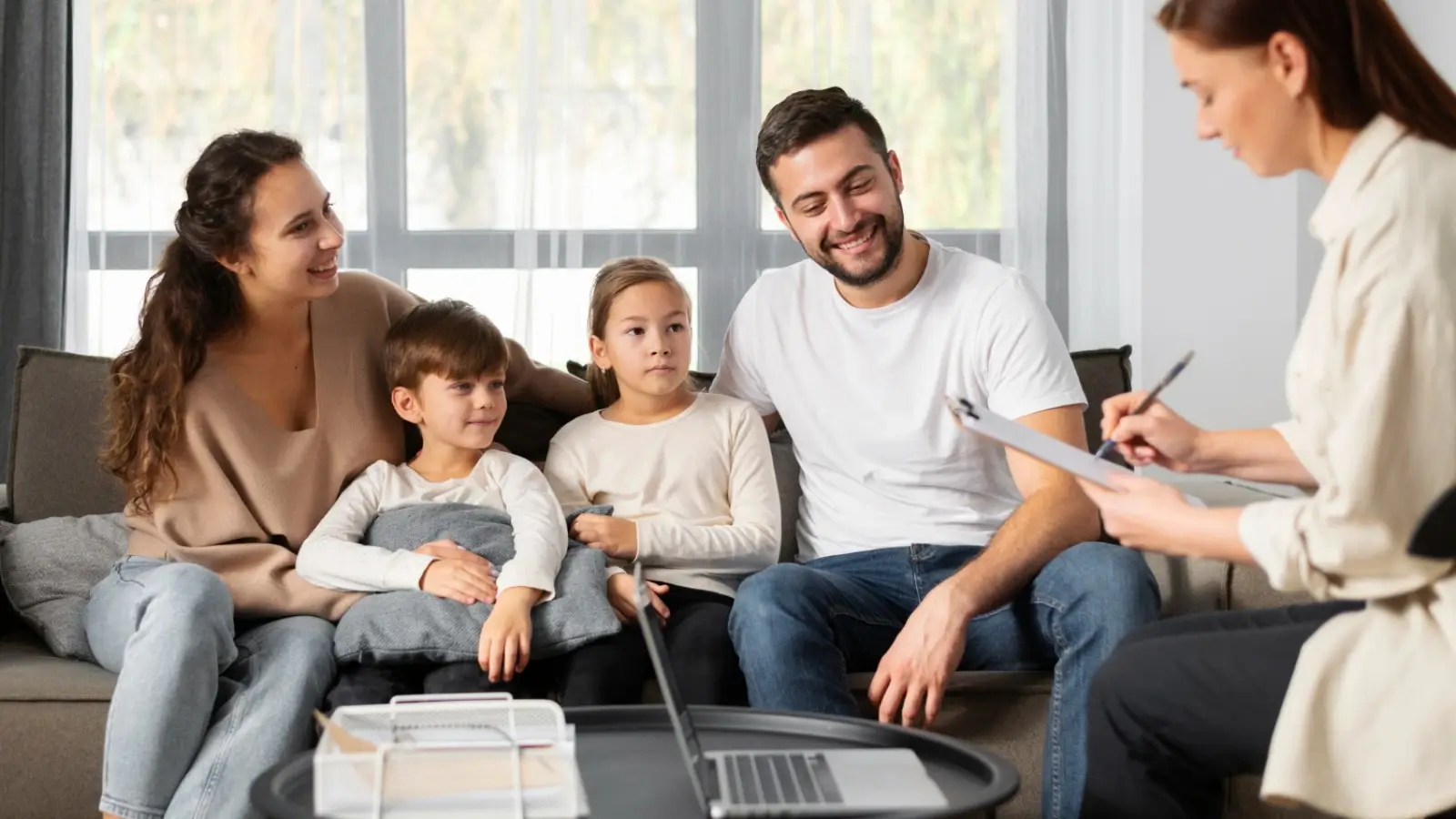 How Counselling Supports Families Going Through Major Life Changes Family in counselling session with therapist providing guidance