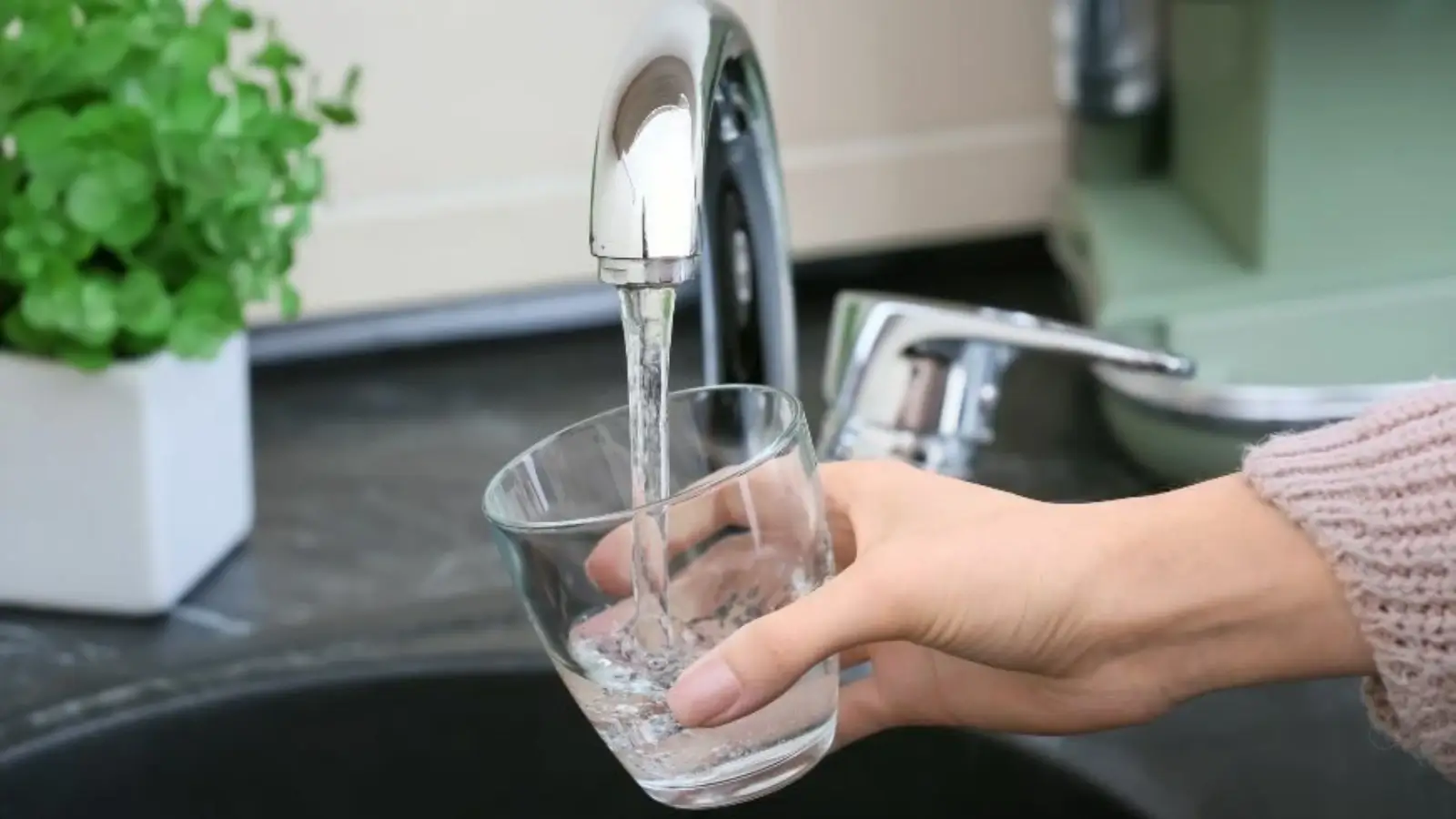 Why Your Plumbing Company Should Go Green Plumber installing eco-friendly low-flow faucet in Anthem home