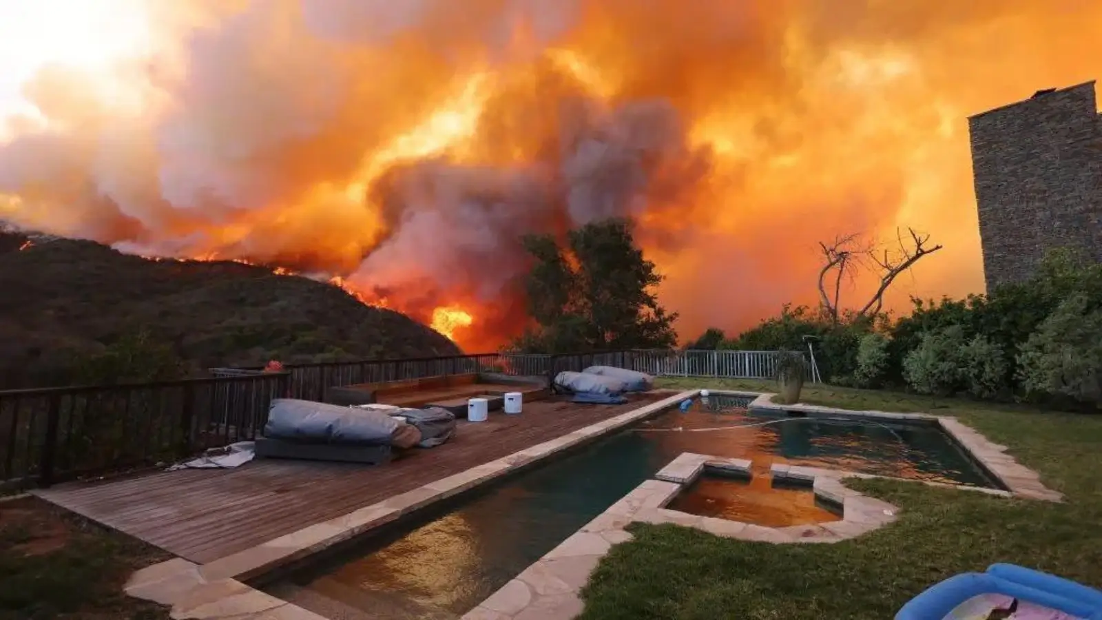 Fire Takes the House, But Not the Future: The Bold New Way Families Are Starting Over Family standing outside fire-damaged home assessing their next steps