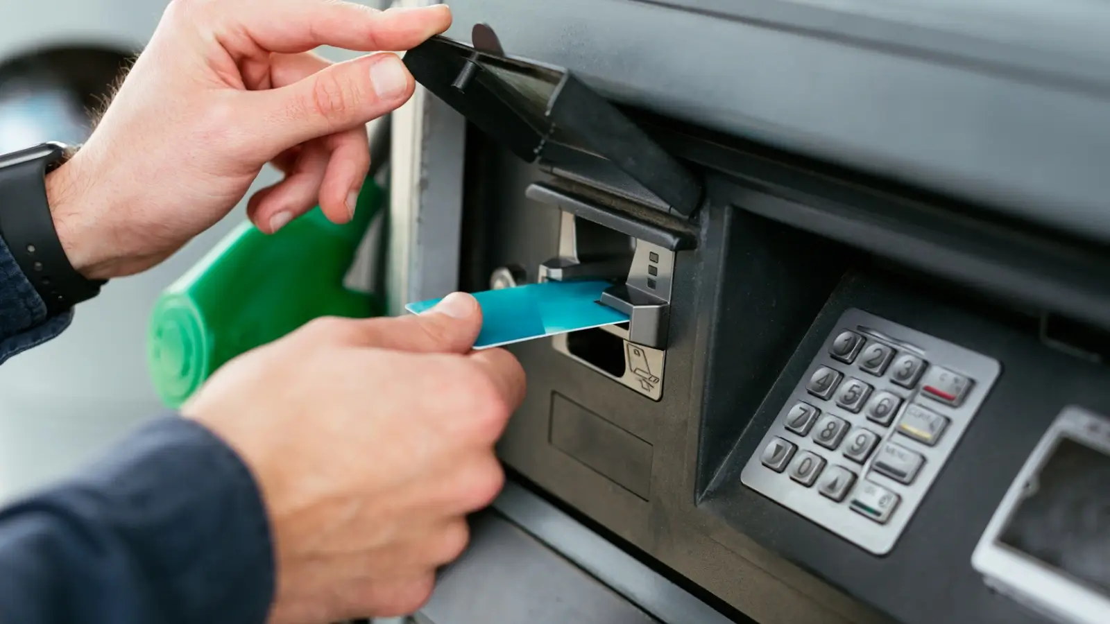 Fuel Card Solution: Streamlining Business Expenses and Fleet Management Fleet manager using a fuel card to refuel company vehicle at petrol station