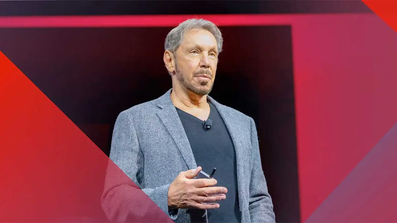 Oracle Co-Founder Larry Ellison Briefly Overtakes Elon Musk as World’s Richest Person on Stock Surge Larry Ellison speaking at Oracle event with stock market and AI growth backdrop