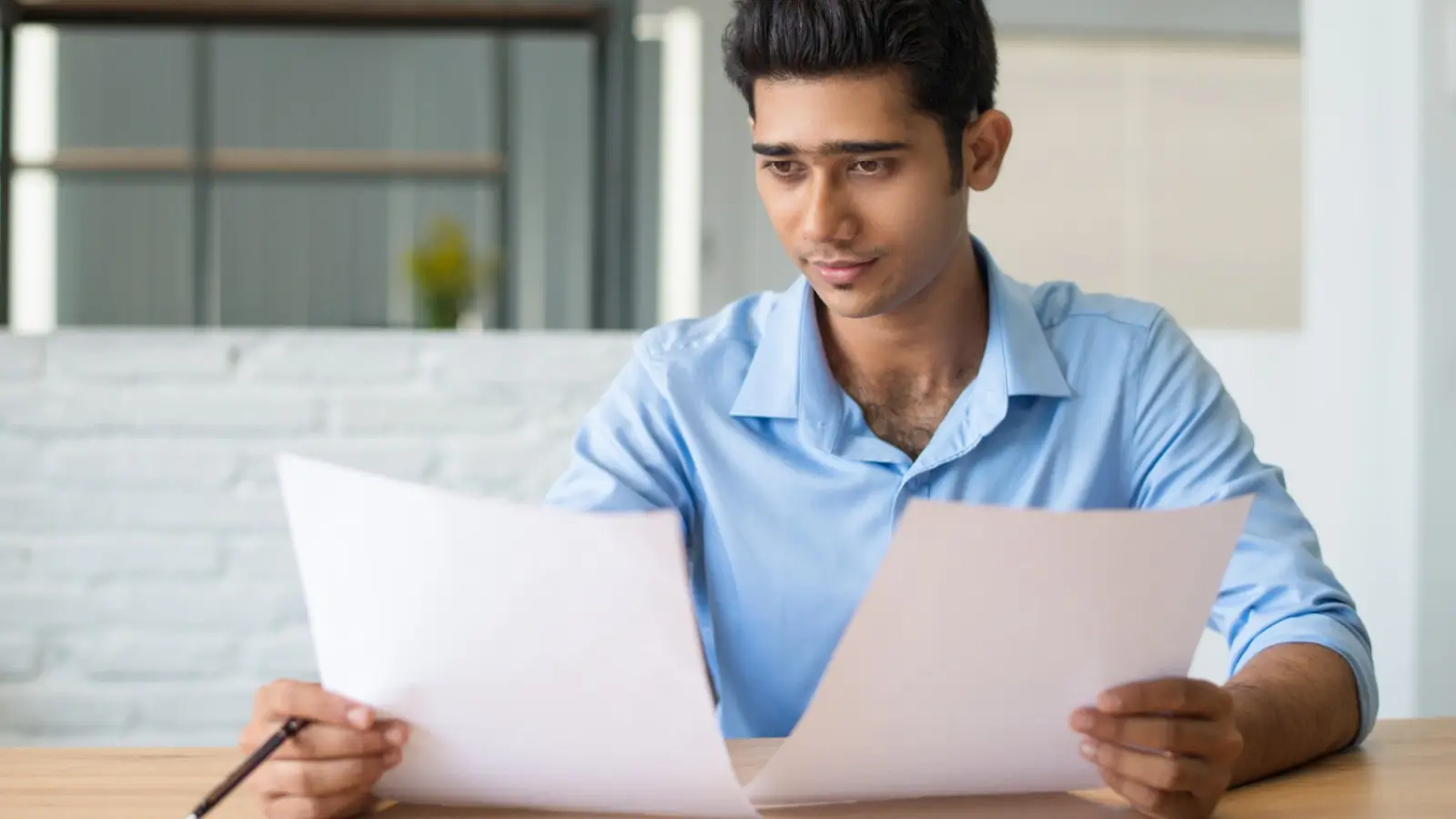 How to Identify and Dispute Inaccurate Credit Report Items Person reviewing credit report for errors and disputes