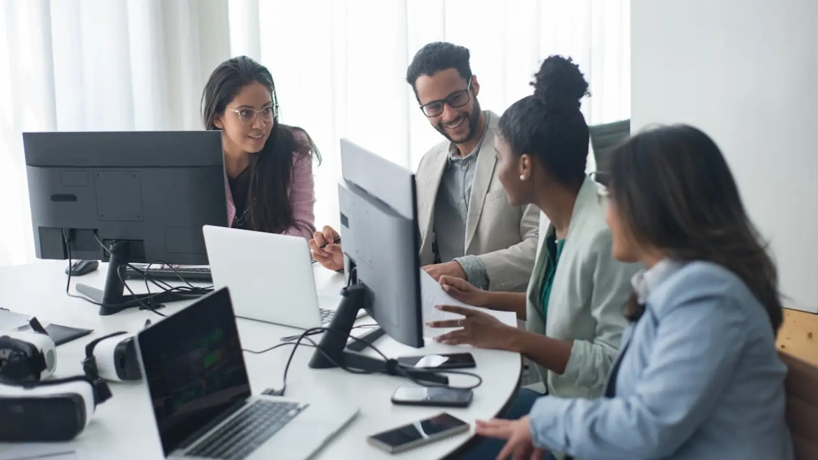 Tech leader reviewing integrated software tools on multiple dashboard screens