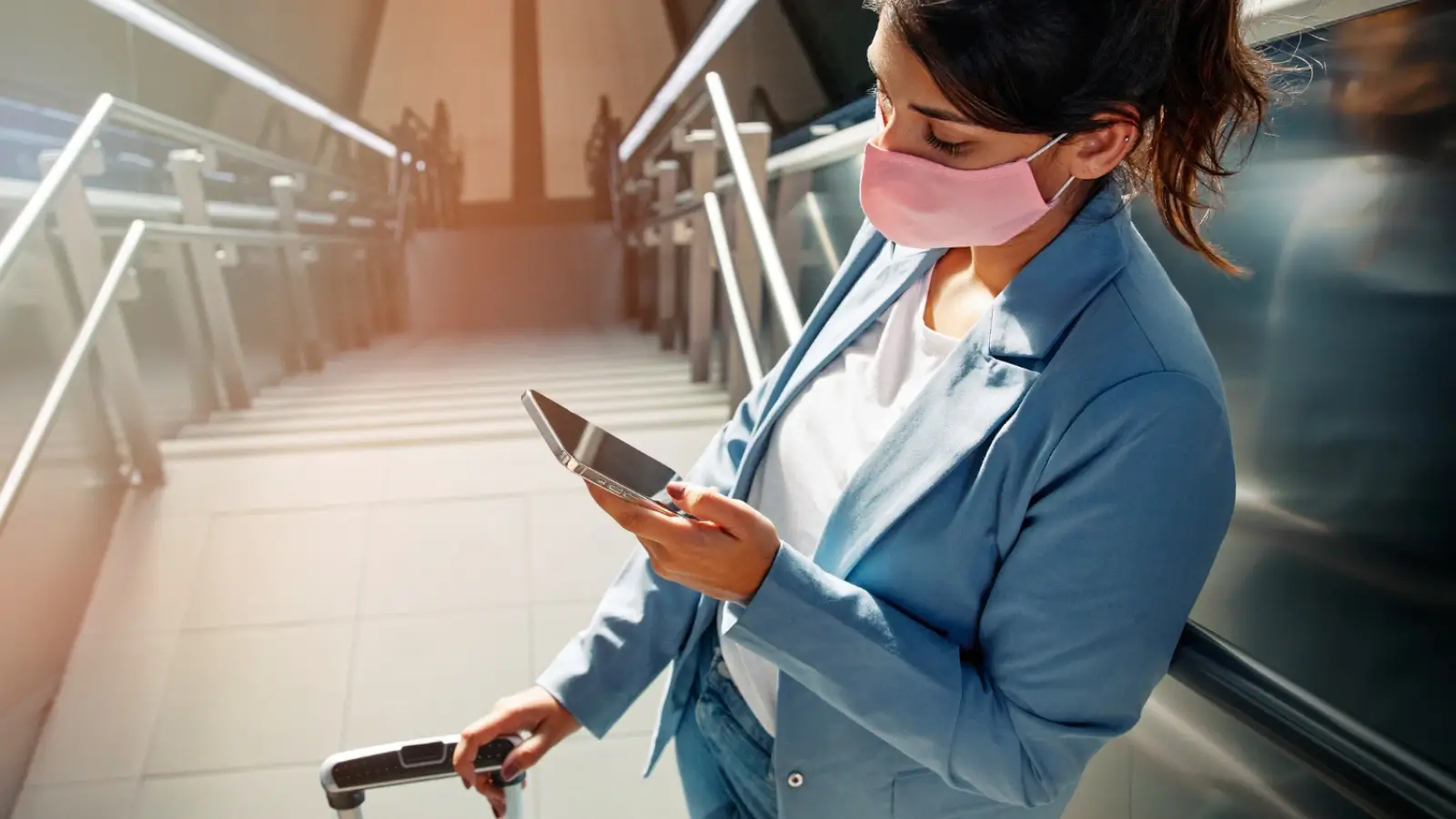 Traveler using mobile app for pre-flight protection at airport terminal