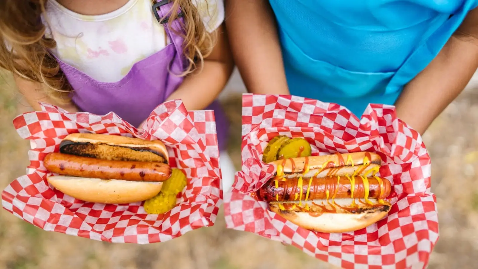 Employees enjoying a team-building event outdoors with games and food