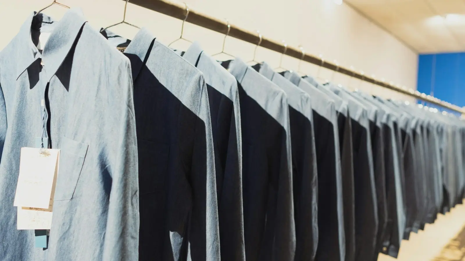 High-quality employee uniforms stacked neatly, showing durability and consistent design