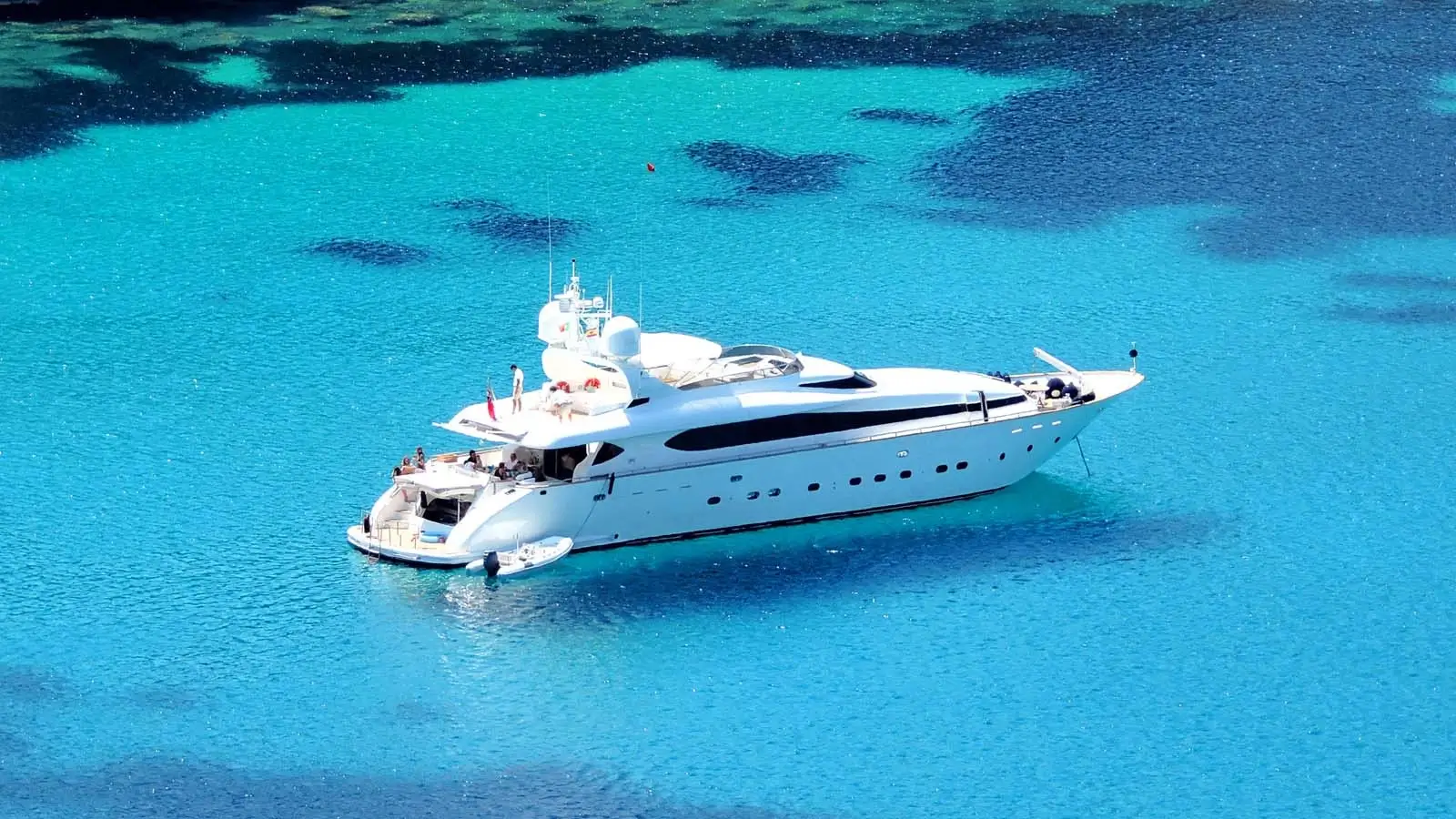 Luxury yacht charter sailing in open waters representing modern charter market growth