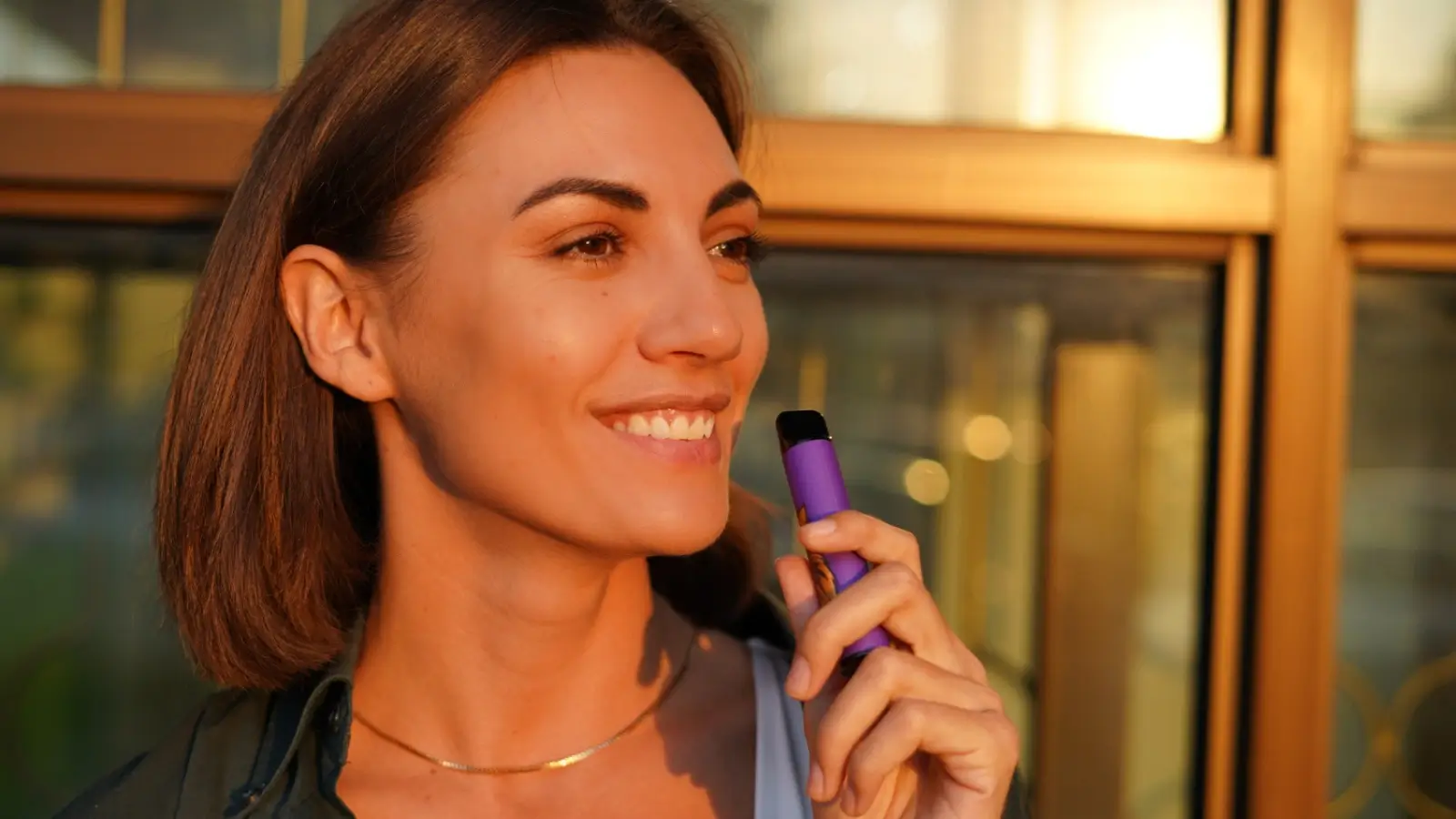 Person checking battery level on a vape device during daily routine