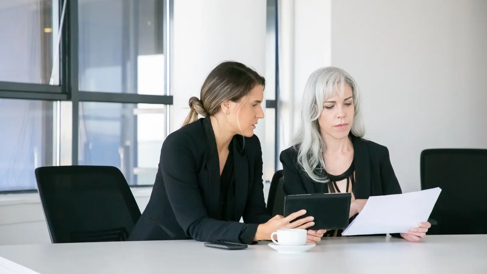 Professional lawyer in Sydney consulting with a client in an office setting