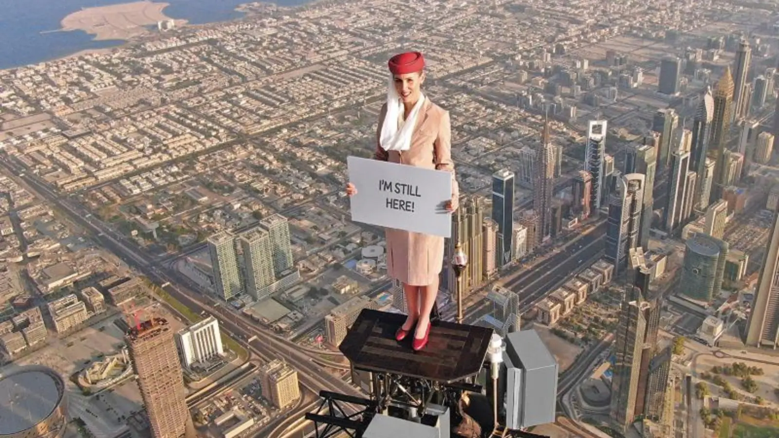 Nicole Smith‑Ludvik standing atop the Burj Khalifa in Emirates Airlines ad