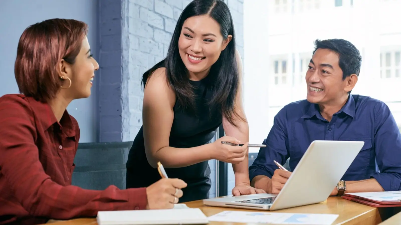 Singaporean professional using AI tools for workplace productivity and digital fluency