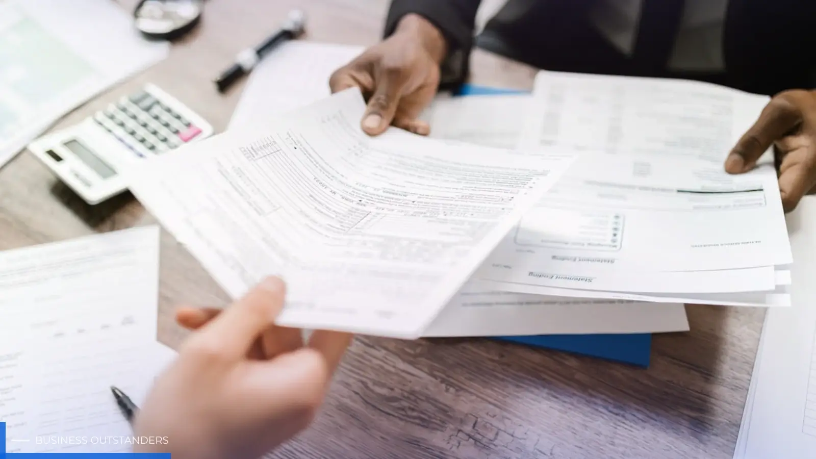 Family members reviewing documents for selling inherited property with cash buyer